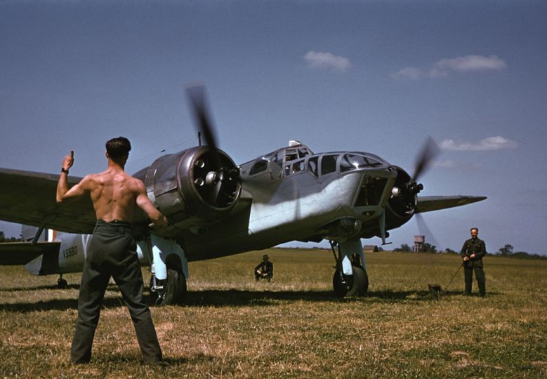 Robert Capa, [A mechanic signals for takeoff to an Allied pilot before a raid over Occupied France, England], 1941. © Robert Capa/International Center of Photography/Magnum Photos.
